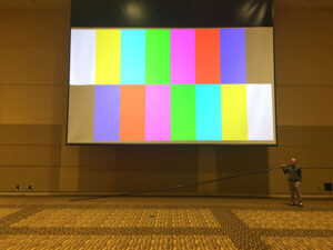 Andrew testing a projector at Mayo